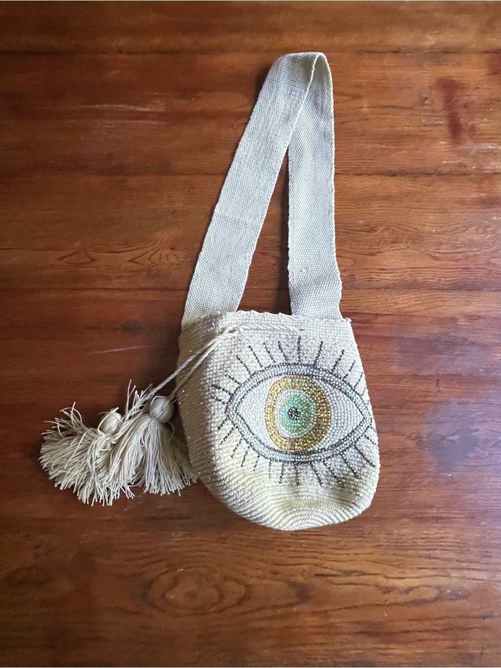 Cream Beaded and Sparkly Eye Crossbody Bag with Tassel Accent